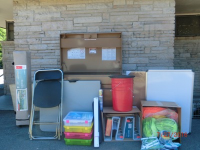 shows gear and supplies stacked around a storage box.
